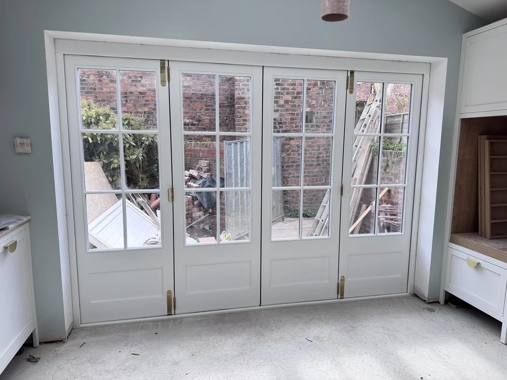 External Bifolds — 4-panel painted timber — garden opening. Handcrafted timber by Bailey Hague Joinery, Yorkshire.