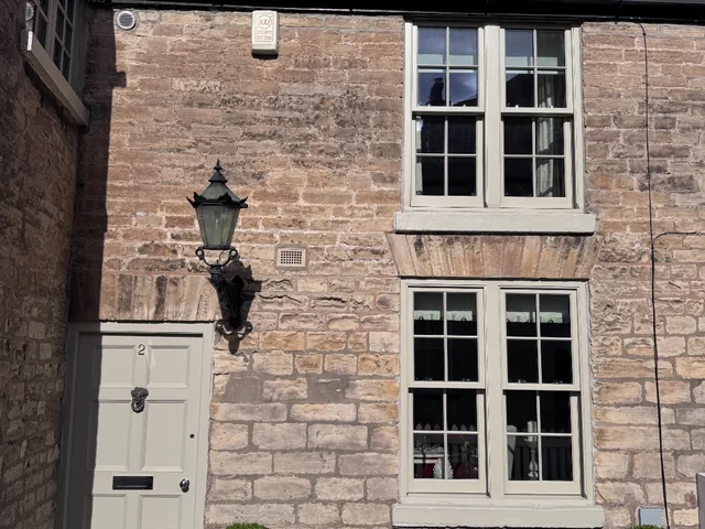 Sage sash windows on stone cottage, Boston Spa