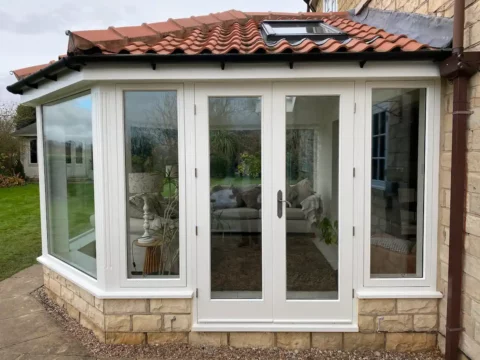 Orangery French doors — Accoya conservatory — Yorkshire. Handcrafted timber by Bailey Hague Joinery, Yorkshire.