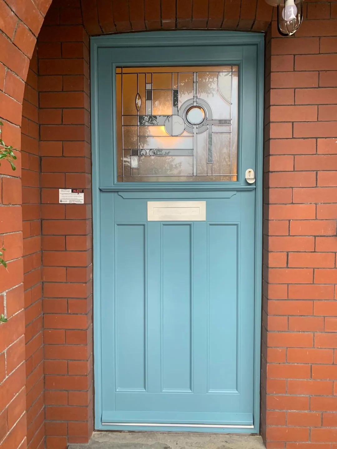 Teal 1930s Art Deco front door with sunburst stained glass — bespoke heritage timber door by Bailey Hague Joinery, Harrogate.