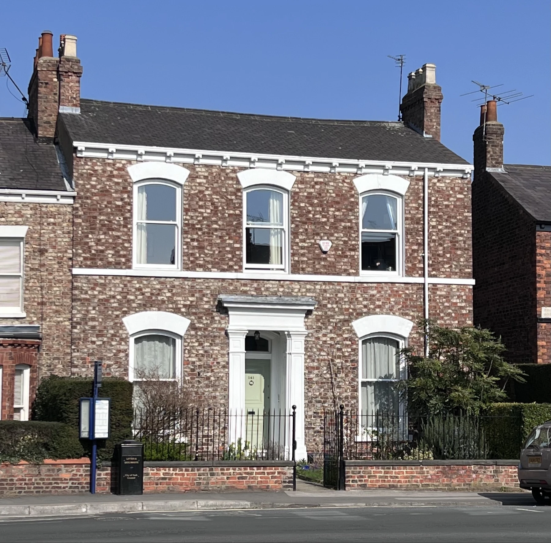 Full frontal elevation of Heworth Victorian villa with white Accoya arched sash windows