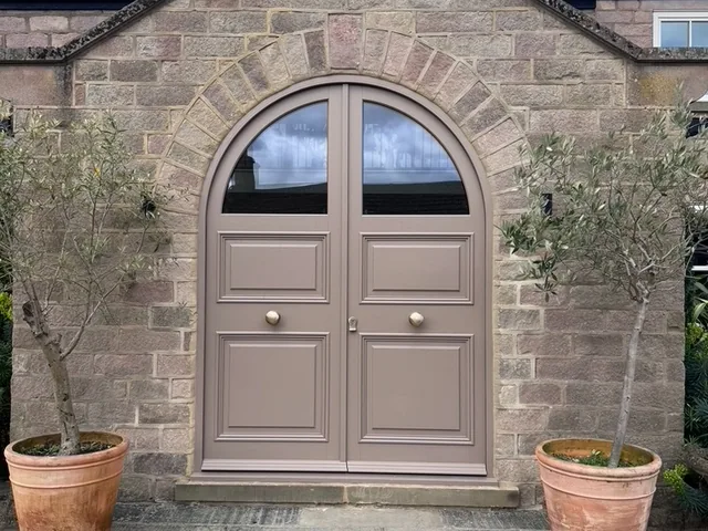 Arched mushroom-painted double entrance doors, Wetherby