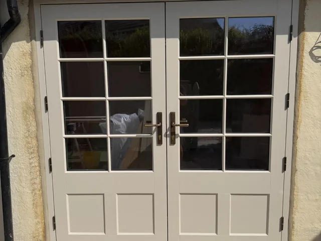 Cream timber French doors under pantile roof, Wetherby
