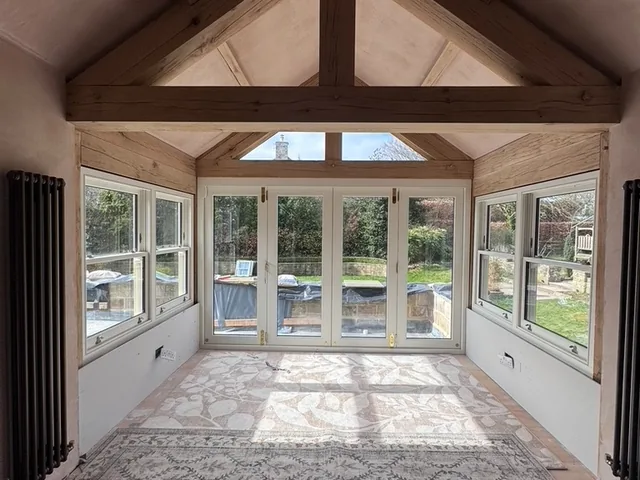 Oak-truss extension interior with sash and bifolds, Wetherby