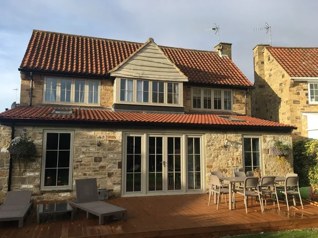 Stone house with cream sash windows and French doors, Wetherby